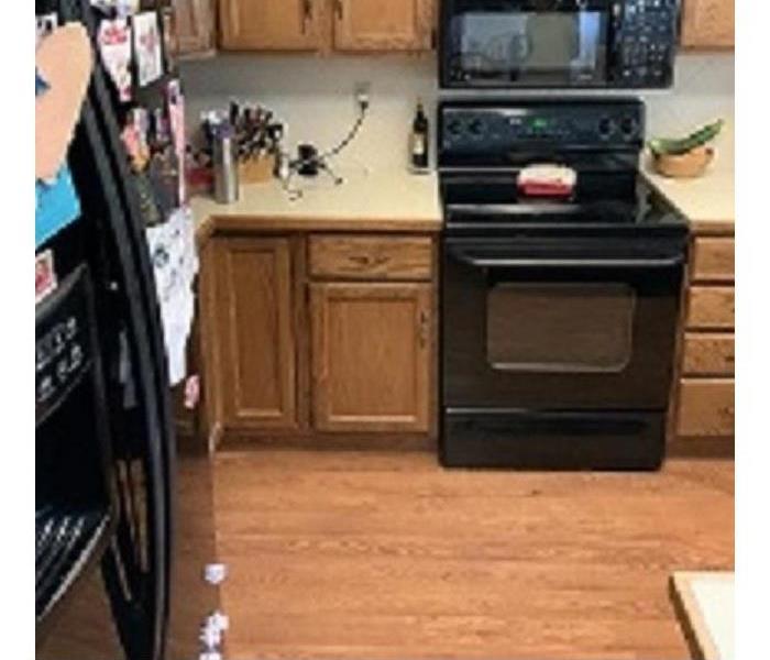 Kitchen laminate flooring lifting due to water damage
